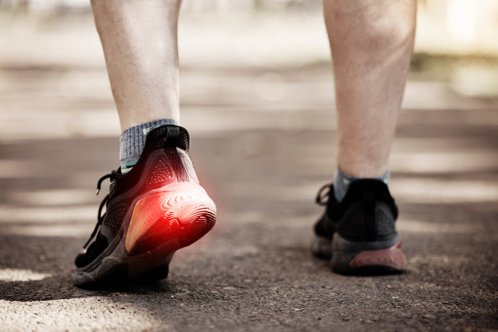 feet running person with red pain overlay fitness health exercise cardio injury risk sports muscle runner athlete legs foot shoe training workout fatigue street